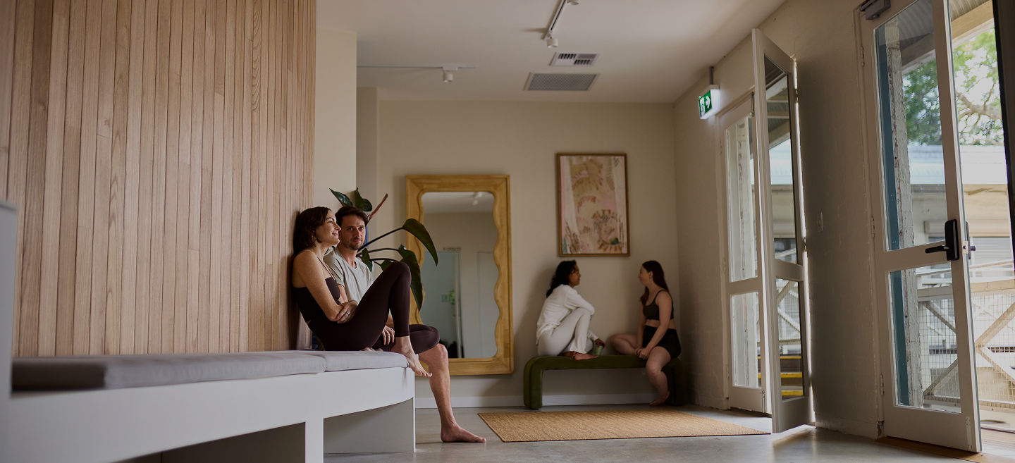 People sitting together in the foyer of Scout Pilates